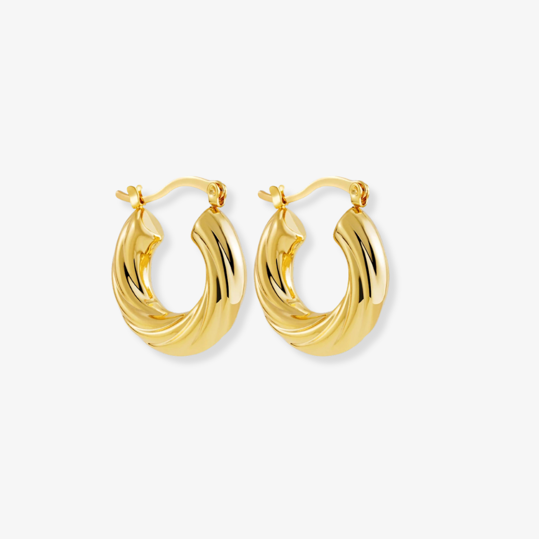 Gold hoop earrings on a white background
