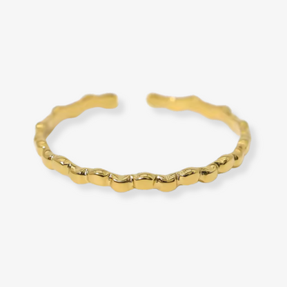 Gold bracelet on a white background