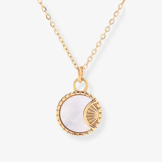 Celara Necklace – Gold sunray pendant with pearly disc on white background by Luzza Studio
