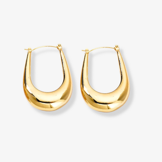 Élan Earrings – Gold teardrop earrings on white background by Luzza Studio	