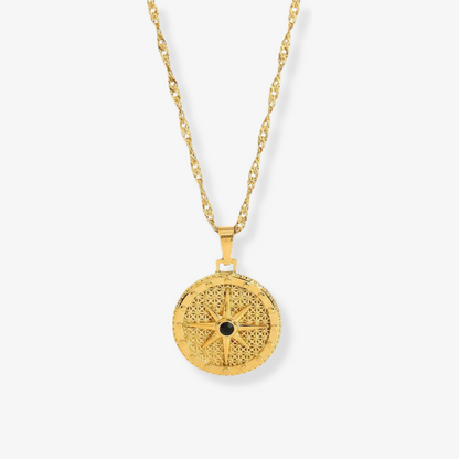North Star Necklace – Gold compass medallion with black enamel on white background by Luzza Studio

