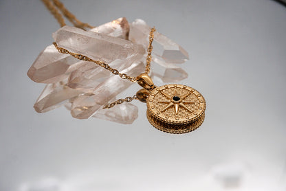 North Star Necklace – Gold compass rose pendant styled in celestial flatlay by Luzza Studio

