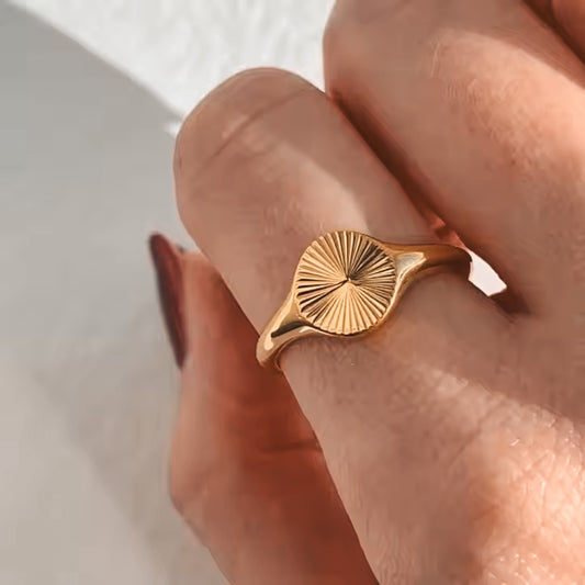 Orla Ring – Gold sunburst signet ring worn by model, styled by Luzza Studio
